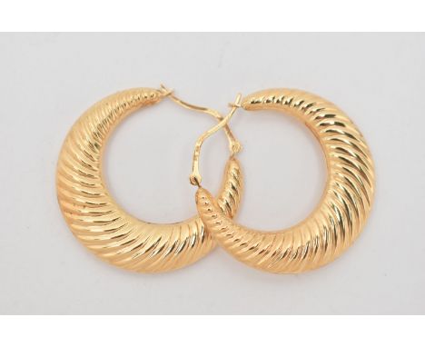 A PAIR OF 9CT GOLD CREOLE HOOP EARRINGS, hollow textured hoops, approximate outer diameter 33.0mm, lever fittings, hallmarked