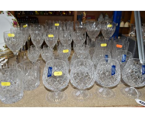 A SELECTION OF STUART DRINKING GLASSES, to include eight brandy balloons, seven white wine, five large red wine, four standar