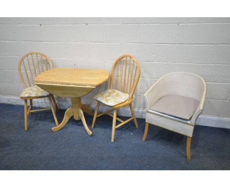 A BEECH DROP LEAF PEDESTAL KITCHEN TABLE, open diameter 92cm x height 73cm, two beech chairs, and a commode chair (condition 