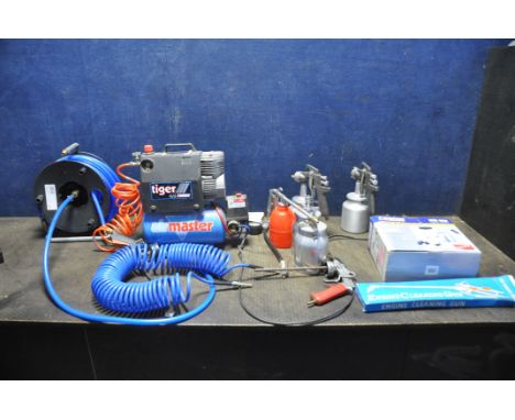 AN AIRMASTER TIGER 4/6 TURBO COMPRESSOR  (PAT pass and working) along with a hose reel, a curly hose, two spray guns, an engi