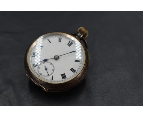 A small continental silver top wound pocket watch having Roman numeral dial with subsidiary seconds in an engine turned silve