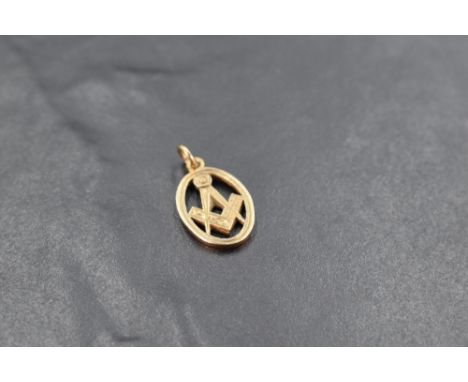 A 9ct gold Masonic pendant, of oval form with typical compass and square motif, marked 375, 2.3grams