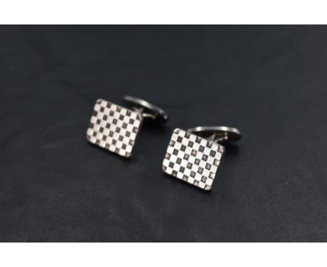 A pair of Georg Jensen silver cufflinks model: 113, having checker board patterned panels