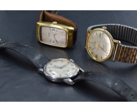 Three gent's Omega wrist watches including Deville automatic and vintage steel cased
we do not test for functionality but the