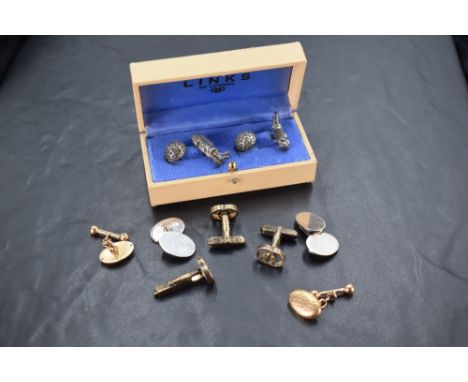 A cased set of golfing interest cuff-links, formed as gold bag and clubs and ball, unmarked, cased, sold along with a pair of
