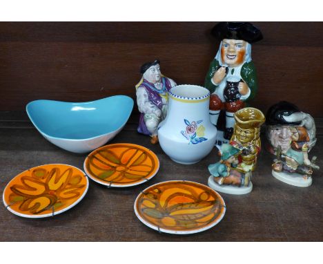 Three small Poole Pottery plates, a Poole Pottery vase, a Midwinter Stylecraft Cannes pattern bowl, two Goebel figures, one a