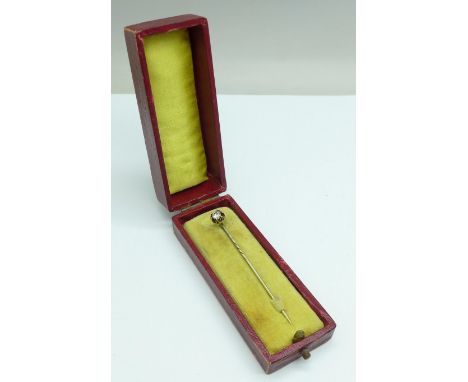 A diamond stick pin set in yellow metal, 1.3g, approximately 0.25carat weight 