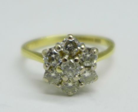 An 18ct gold and diamond cluster ring, 0.75carat diamond weight, 2.7g, J 
