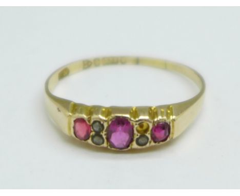 A 9ct gold, ruby and pearl ring, Chester hallmark, c.1910, worn date letter, lacking one seed pearl, 1g, R 