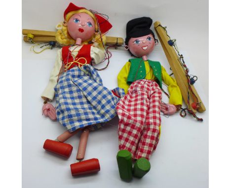Two vintage Pelham puppets; Dutch girl and boy, with one box marked Dutch Boy 