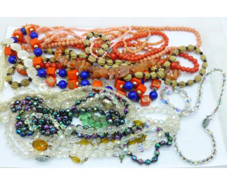 Sixteen vintage necklaces including glass, mother of pearl and faux coral 