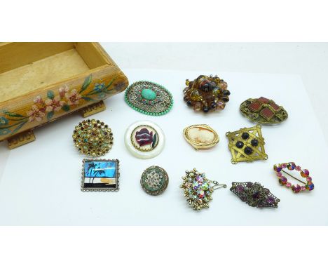 Twelve vintage brooches including micro mosaic, cameo and butterfly wing 
