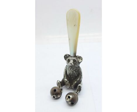 A hallmarked silver and mother of pearl Teddy bear rattle, Crisford &amp; Norris, worn Birmingham date letter 