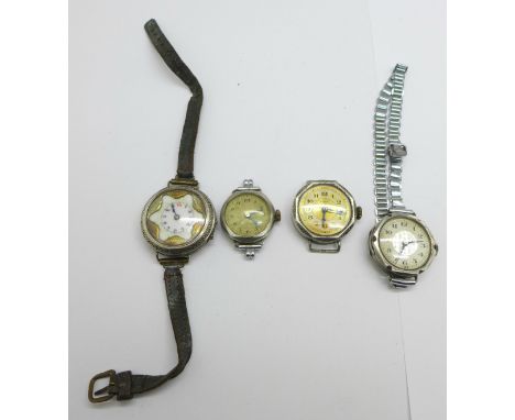 Four lady's silver cased wristwatches, one lacking button 