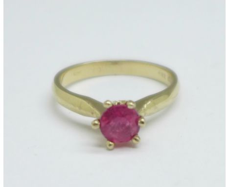 A yellow metal and ruby solitaire ring, marked 750, 3.1g, L 