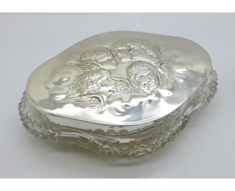 A silver topped glass trinket box decorated with Reynolds angels, Chester 1902, top 12cm wide 