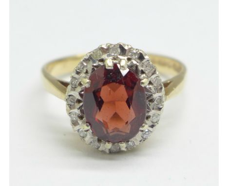 A 9ct gold, garnet and white sapphire cluster ring, 3.4g, O 