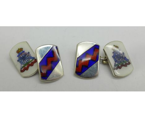 A pair of silver and enamelled military cufflinks 