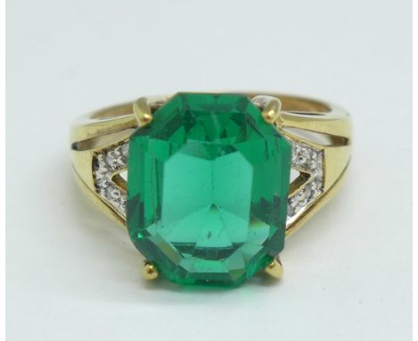 A 9ct gold, green stone ring with diamond accents, 3.2g, O 