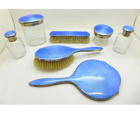 A seven piece silver and blue guilloche enamel dressing table set, Birmingham 1928, Adie Brothers, (circular pot and clothes 