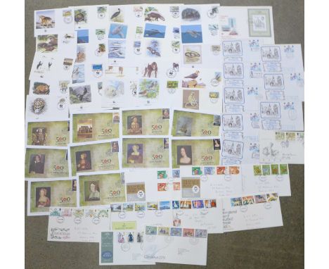 Fifty-four stamp first day covers;-twenty-five WWF, ten Henry VIII, eight Christmas and eleven others 