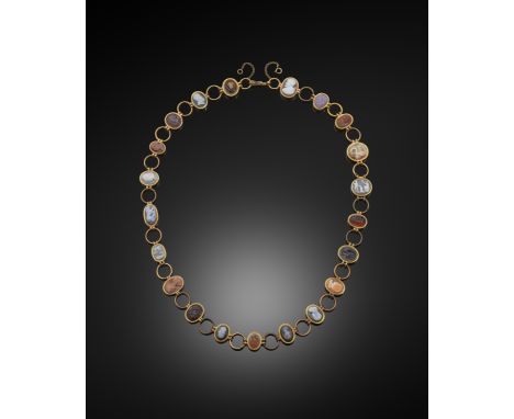 An early 19th century gold necklace mounted with twenty-one classical and neo-classical cameos and intaglios, each carved sto