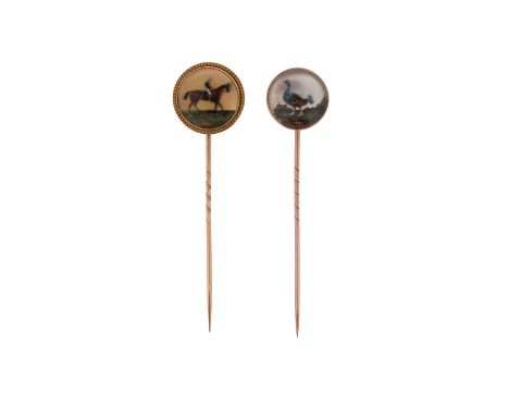 Two gold-mounted reverse carved crystal intaglio stick pins, one depicting a chestnut horse in profile with jockey up in yell