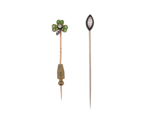 Two gem-set stick pins, including a stick pin set with a trefoil of demantoid garnets and centred with an old circular-cut di