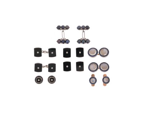 A set of Art Deco dress cufflinks and studs, each black onyx rectangular link is centred with a small diamond in white gold, 