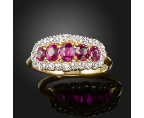 A early 20th century ruby and diamond cluster ring, set with graduated oval-shaped rubies within a surround of single-cut dia