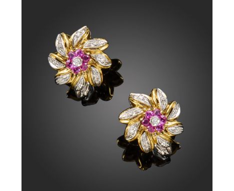 A pair of ruby and diamond flowerhead earrings, set with circular-cut rubies and diamonds in two-colour 18ct gold, Birmingham