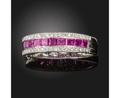 A ruby and diamond half-hoop ring, set with calibre-cut rubies between rows of round brilliant-cut diamonds in white gold, si