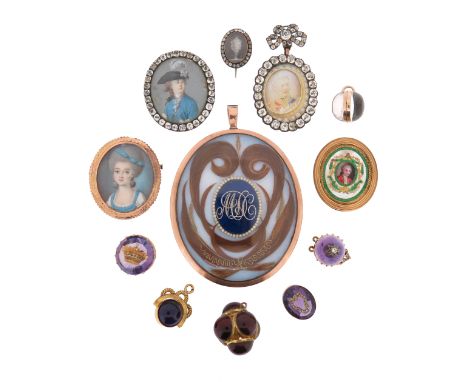 λ&nbsp;A late 18th century mourning pendant, centred with a blue enamel plaque with initials and border set with glass beads 