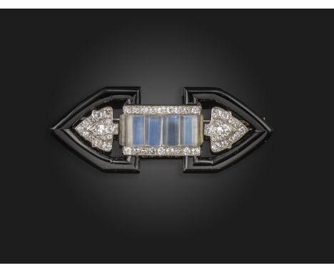 An Art Deco onyx, moonstone and diamond brooch, the arrow-head onyx terminals centred with diamond-set blossom-form sections 