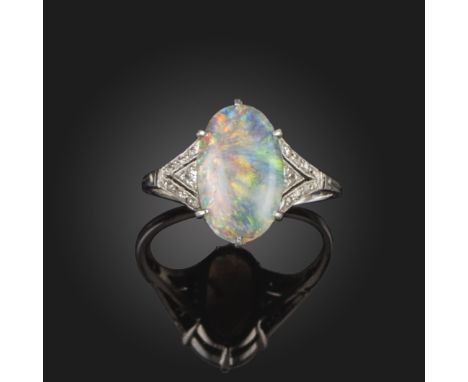 An Edwardian opal and diamond ring, the oval opal is set with rose-cut and single-cut diamonds to the triangular-shaped openw