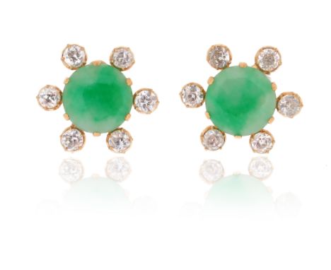 A pair of jade and diamond earrings, the jade cabochons set within a surround of old circular-cut diamonds in gold, clip fitt