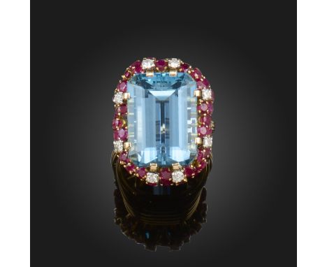 An aquamarine, ruby and diamond cocktail ring by Mellerio, the emerald-cut aquamarine weighs approximately 28.00cts and set w