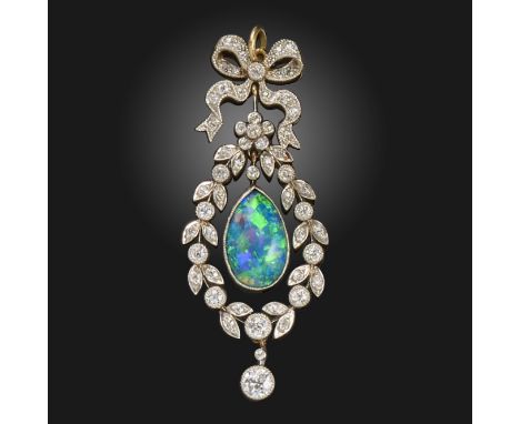 A Belle Epoque opal and diamond pendant, the diamond-set bow suspends a pear-shaped black opal, suspending a further circular