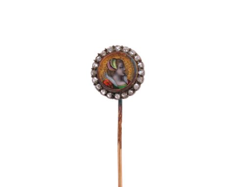 A French Medieval Revival enamel and diamond-set stick pin, c.1870, the polychrome enamel circular plaque depicting the head 