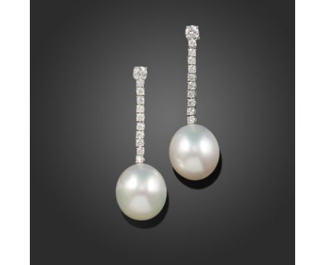 A pair of South Sea cultured pearl and diamond drop earrings, the slightly oval pearls each suspending from an articulated li