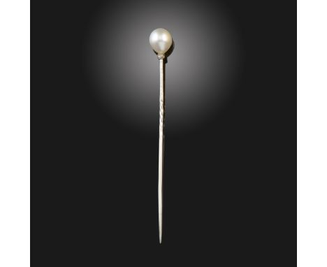 A French cultured pearl stickpin, the platinum shaft with diamond-set rondel, French control mark, 7.5cm long, fitted tapered