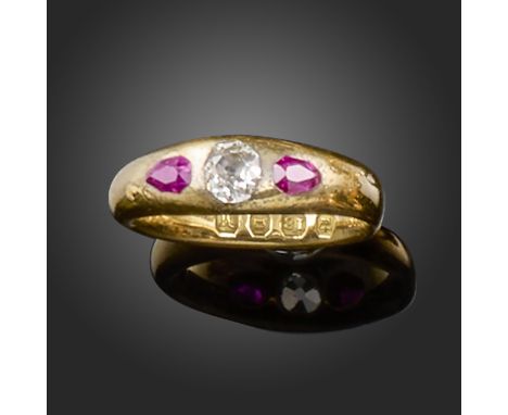 A late 19th century ruby and diamond gold gypsy ring, set with an old cushion-shaped diamond and two pear-shaped rubies in 18