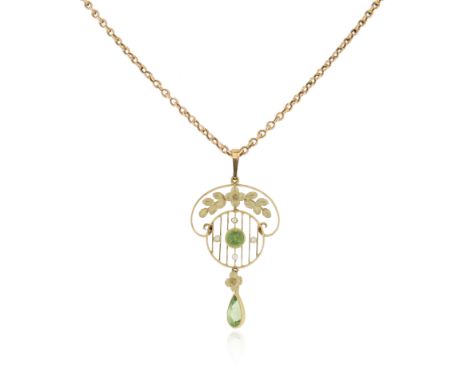 An Edwardian gold peridot and seed pearl pendant, the openwork pendant with textured floral goldwork, the central circular co