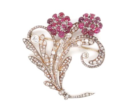 A ruby and diamond-set floral brooch, the foliate scroll mount set with old cushion-shaped and rose-cut diamonds in gold, wit