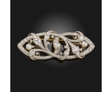 An Art Nouveau diamond and pearl brooch, of scrolling foliate form, millgrain-set with graduated old circular-cut diamonds an