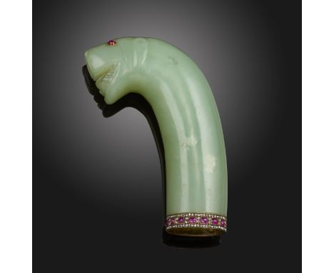 A 19th century nephrite Middle Eastern lion's head dagger hilt, in the Mughal manner, with cabochon ruby eyes and the lower e