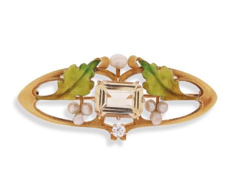 An Art Nouveau topaz and enamel seed pearl brooch by Krementz &amp; Co, c1900, the emerald-cut yellow topaz within border of 