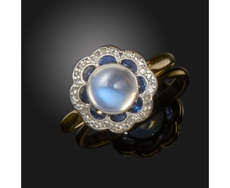 A sapphire, diamond and moonstone cluster ring, set with a cabochon moonstone within a surround of demi-lune-cut sapphires an