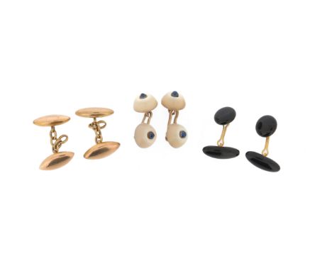 A pair of gold torpedo-form cufflinks, a pair of gold and black enamel cufflinks and a pair of cabochon sapphire-centred shel