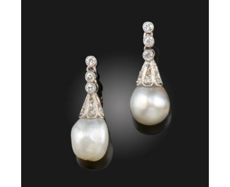 A pair of early 20th century natural pearl and diamond drop earrings, the natural pearls with diamond-set caps, suspending fr